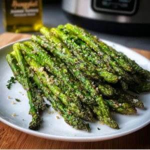 Air Fryer Garlic Butter Asparagus 3 Delicious air fryer garlic butter asparagus served on a plate