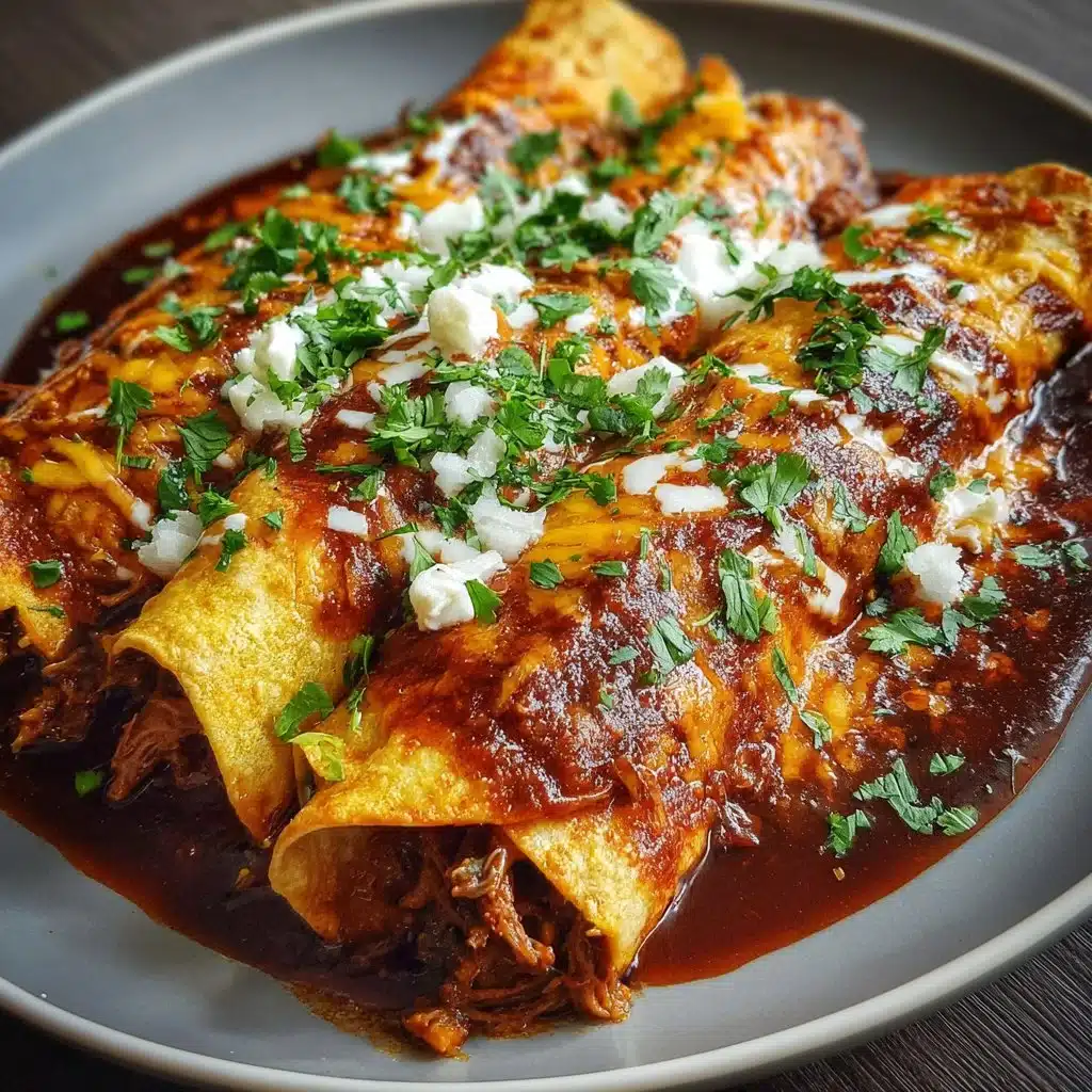 Delicious Birria Enchiladas topped with cheese and fresh cilantro