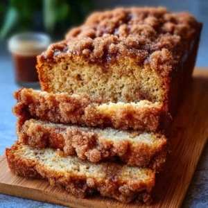 Delicious Cinnamon Crumb Banana Bread with a golden crust and crumb topping