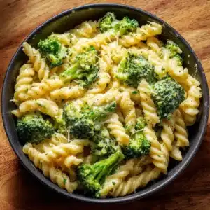 Creamy cheesy broccoli pasta dish served in a bowl