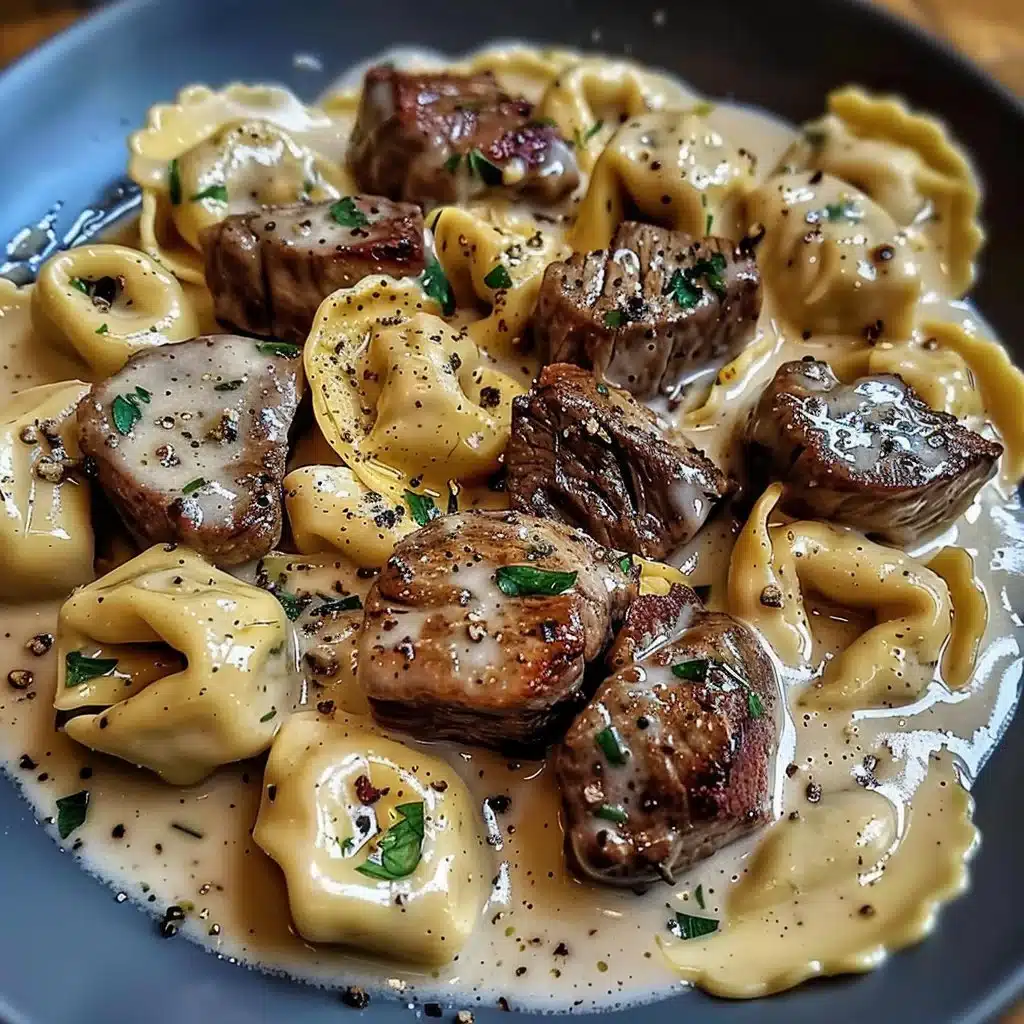 Cracked garlic steak tortellini in creamy sauce served in a bowl
