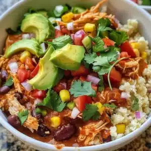 Healthy Chicken Enchilada Bowls with Cauliflower Rice 3 Healthy chicken enchilada bowls with cauliflower rice on a plate