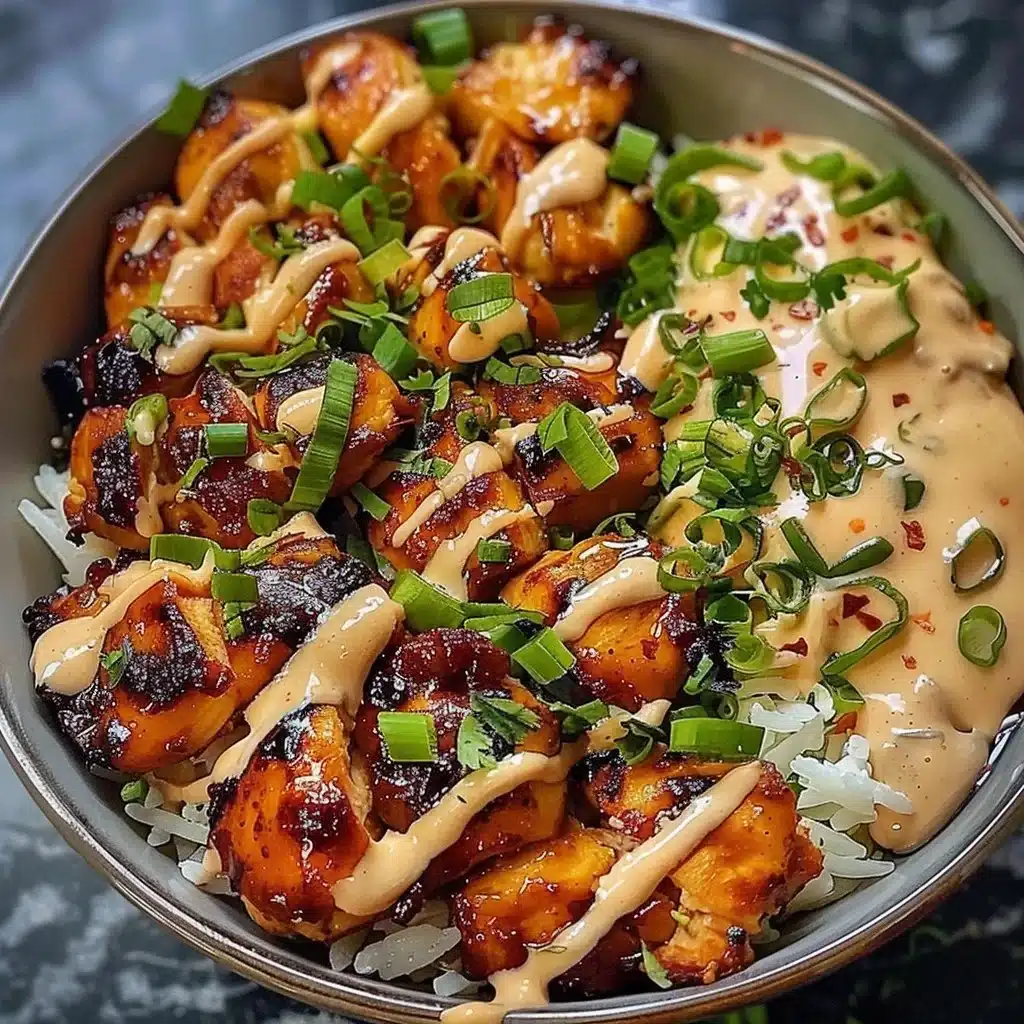 Honey Sriracha Chicken rice bowls drizzled with creamy lime sauce