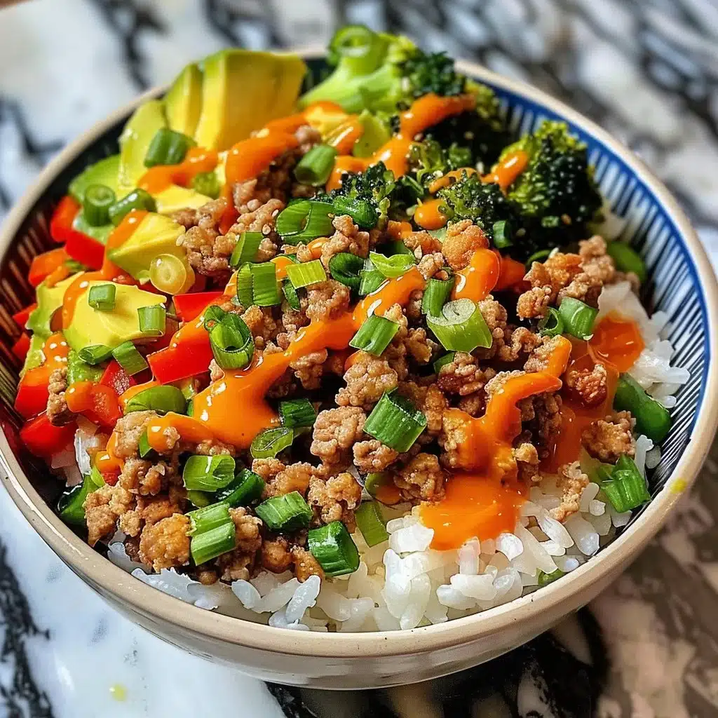 Bang Bang Ground Turkey Rice Bowls topped with fresh vegetables and sauce