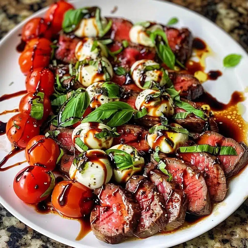 Grilled flank steak caprese topped with fresh tomatoes and balsamic dressing.