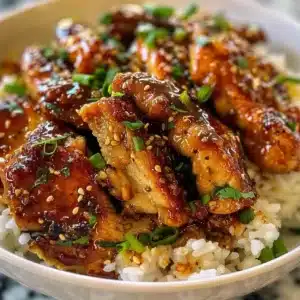 Delicious Lazy Honey Garlic Chicken served on a plate with sesame seeds and green onions