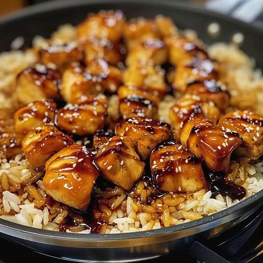 One-Pan Honey BBQ Chicken served with rice on a rustic kitchen table