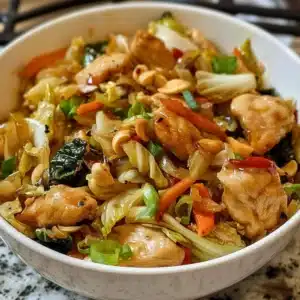 Delicious Chicken Cabbage Stir-Fry served in a bowl with colorful vegetables.