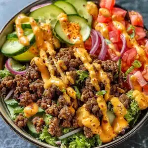 Healthy Burger Bowl Recipe with Secret Sauce 3 Healthy burger bowl topped with secret sauce and fresh ingredients